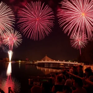 Submit Obituary Fireworks bursting in the night sky over Savannah's waterfront during Independence Day celebration.