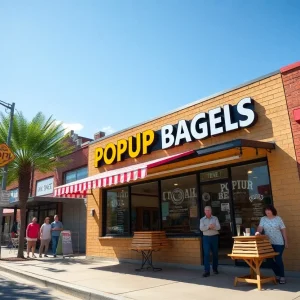 Customers enjoying bagels outside a new PopUp Bagels location