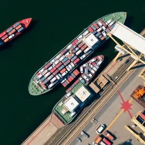 Aerial view of the Port of Brunswick showing cargo ships and loading operations.