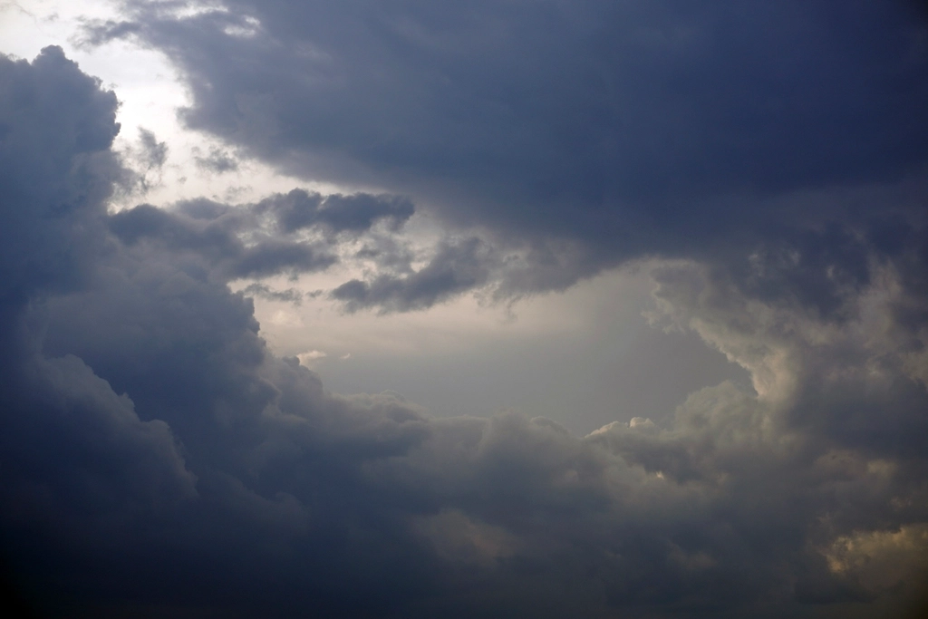 Dark storm clouds gathering over a shoreline